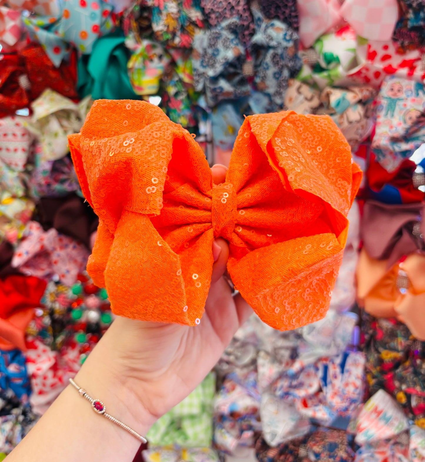 Orange sparkle bow