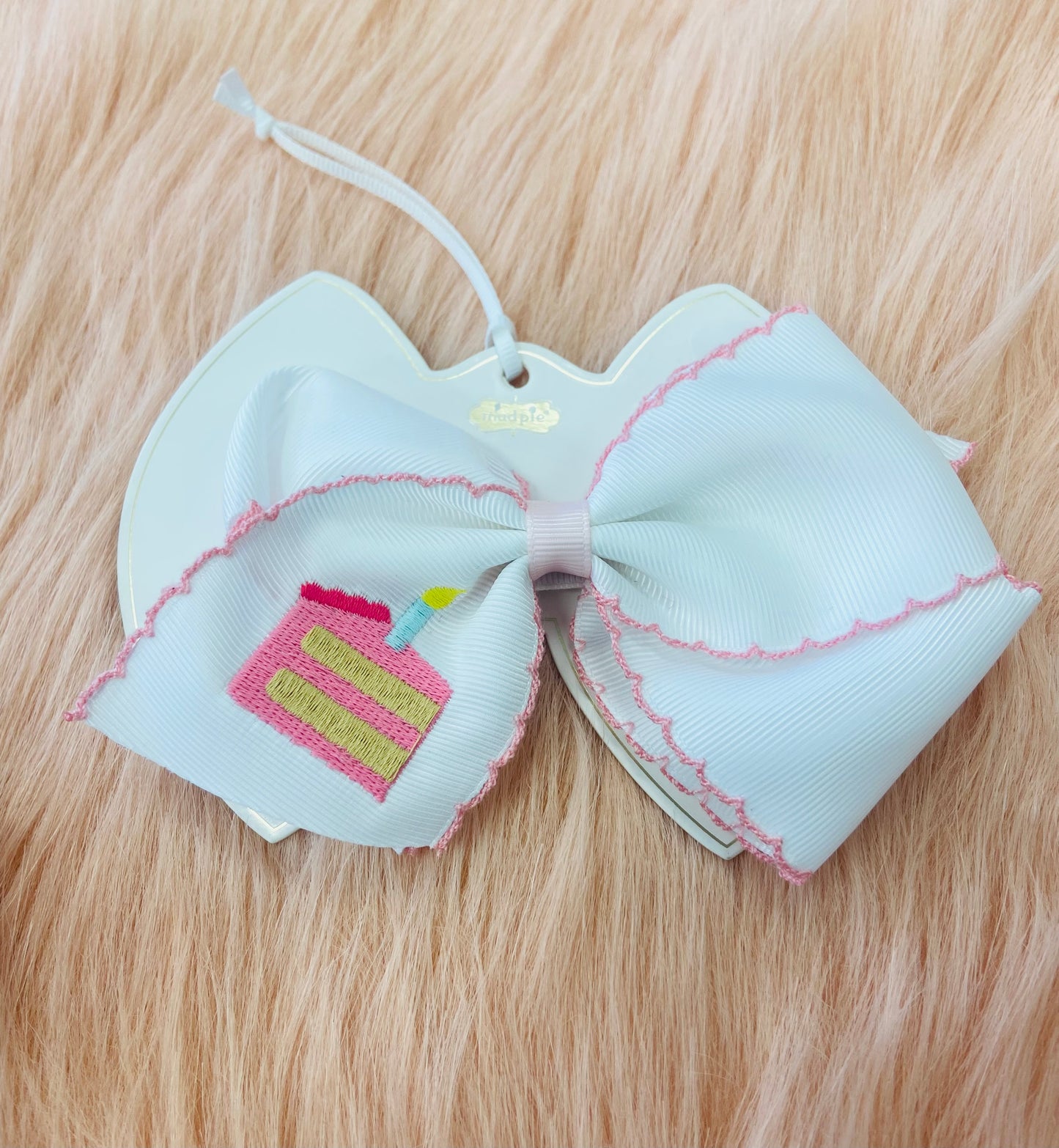 Mud pie cake embroidery bow