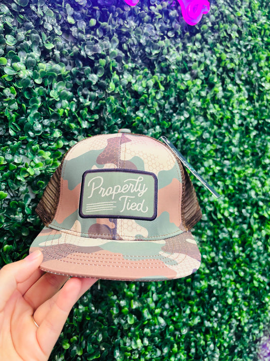 Boy sportsman Trucker hat properly tied